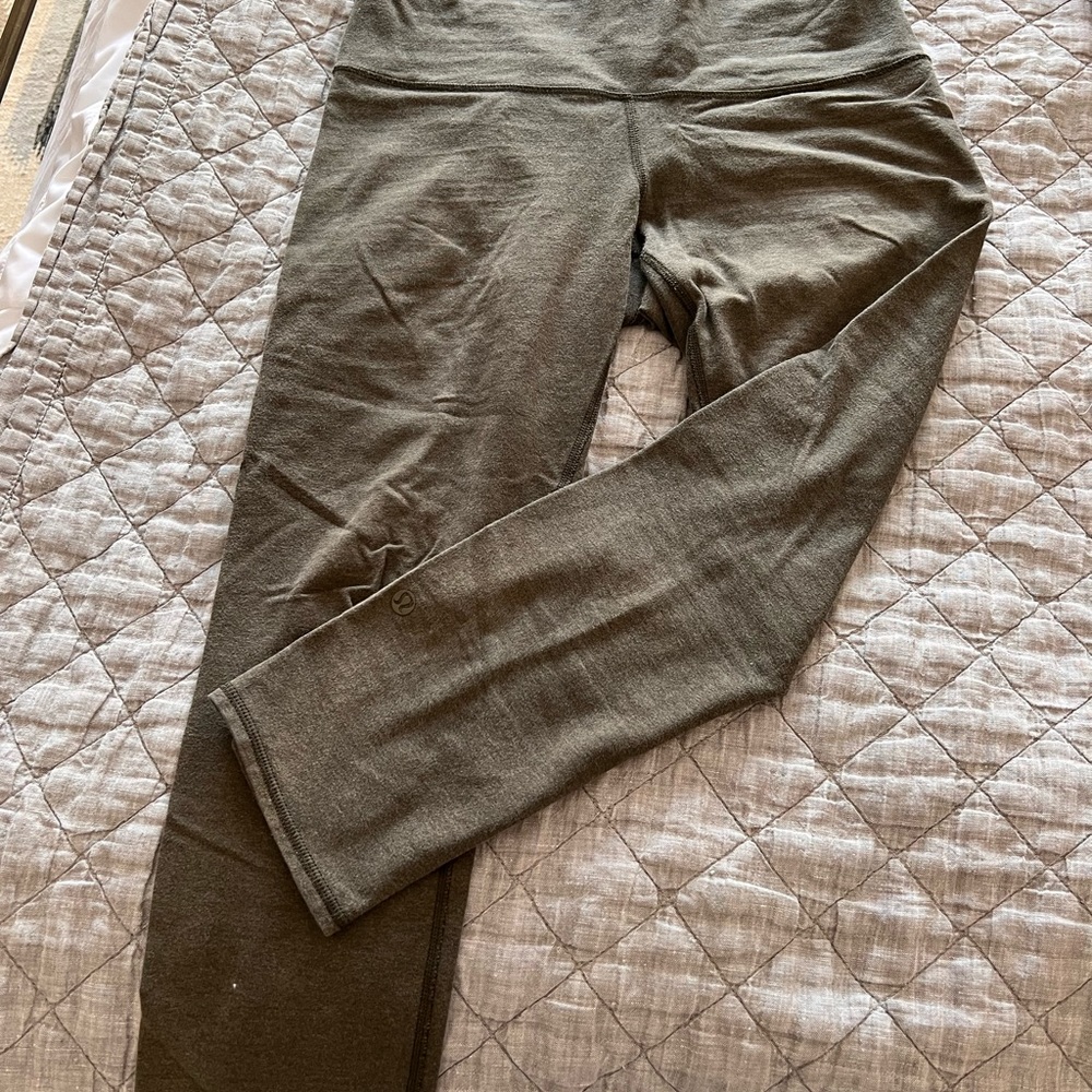 Two lululemon yoga pants , one in green and one in maroon
